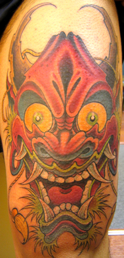Looking for unique Tattoos? oni on leg tattoo